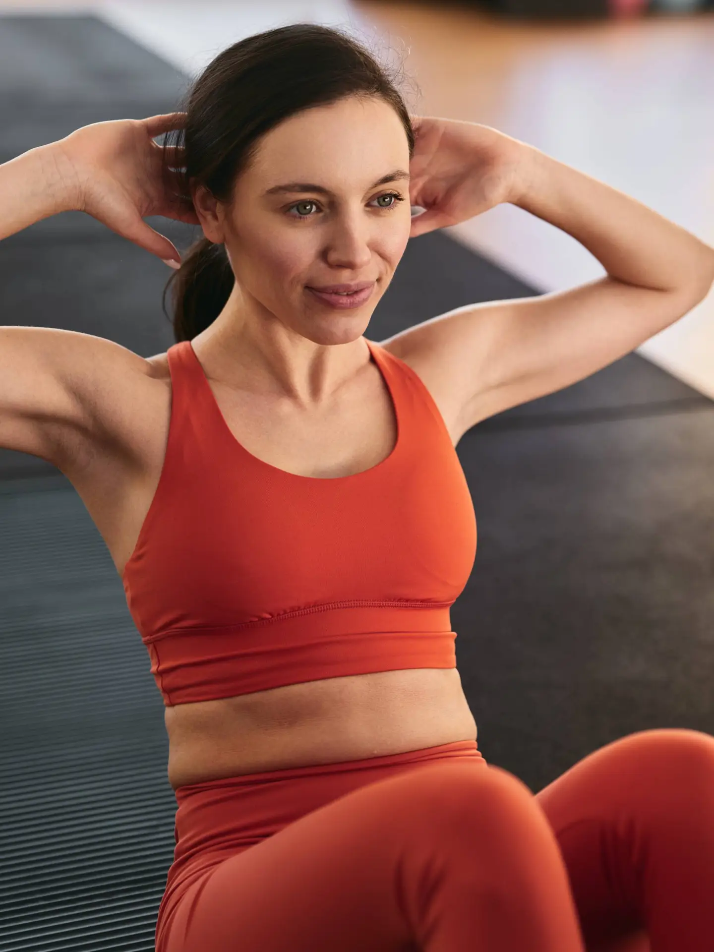 woman-doing-abdominal-crunches-exercise-at-gym-2023-11-27-05-19-12-utc-1